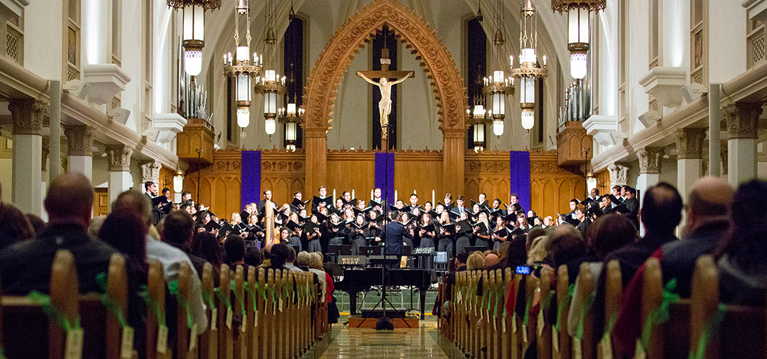 Large choir performing in a catholic church